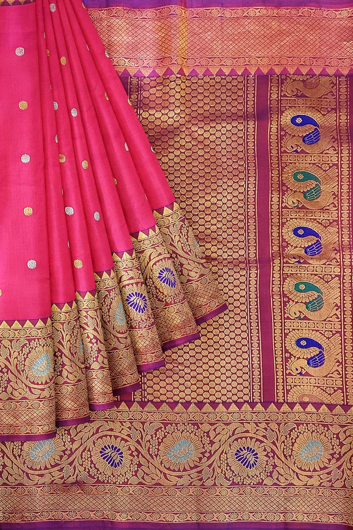 Handwoven Gadwal pure silk saree in pink with gold & silver motifs  all over the body.