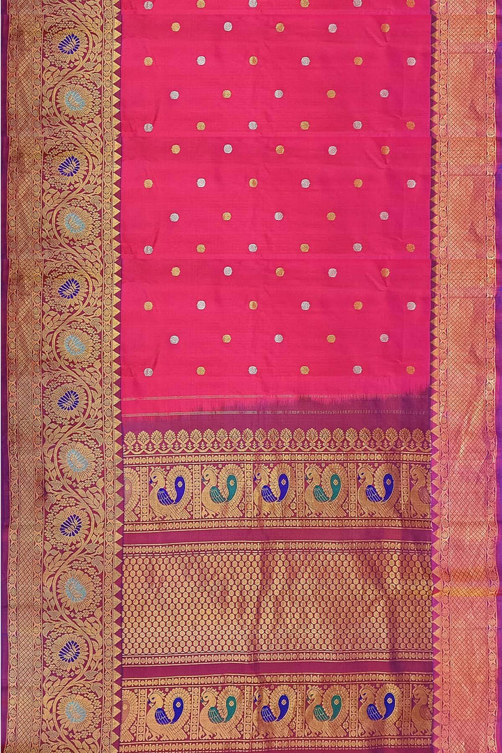 Handwoven Gadwal pure silk saree in pink with gold & silver motifs  all over the body.