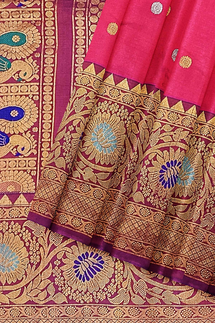Handwoven Gadwal pure silk saree in pink with gold & silver motifs  all over the body.