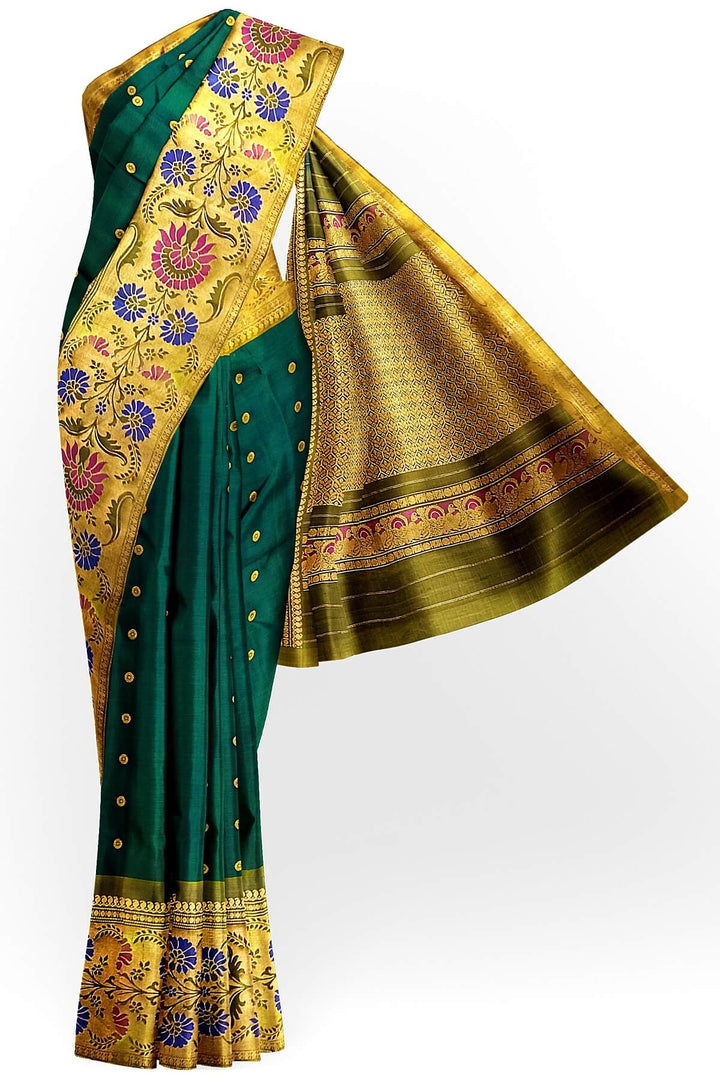 Handwoven Gadwal pure silk saree in bottle green with gold  motifs  all over the body.