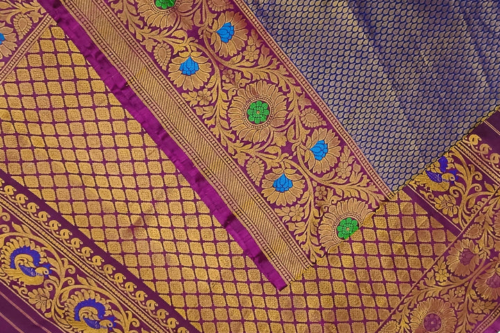 Handwoven Gadwal pure silk brocade saree in blue with rain drop motifs  all over the body.