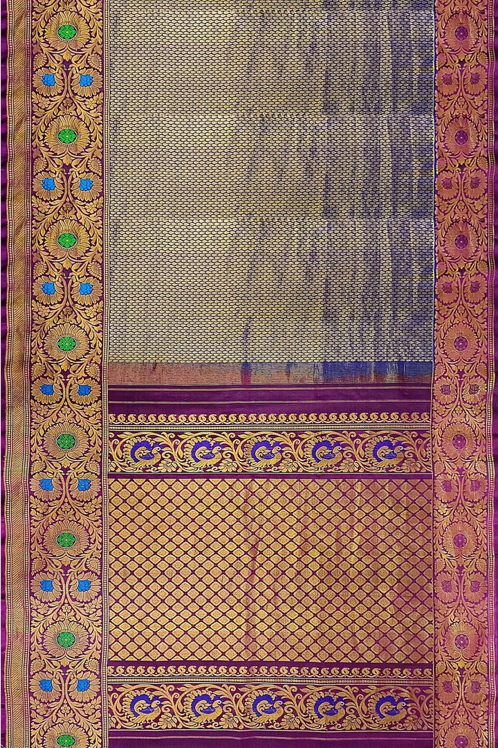 Handwoven Gadwal pure silk brocade saree in blue with rain drop motifs  all over the body.