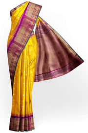 Handwoven Gadwal pure silk saree in mustard with round motifs on the body .