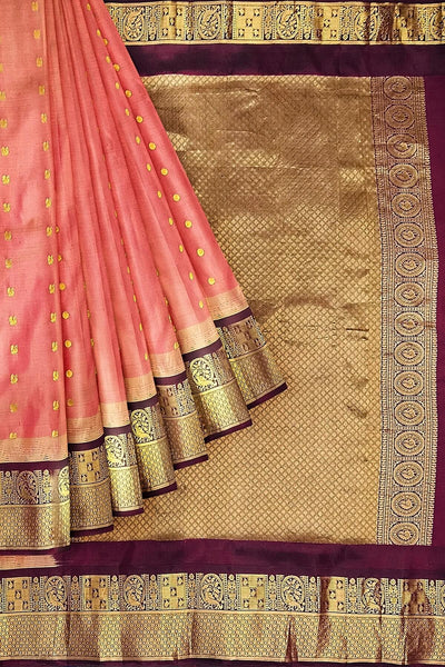 Gadwal pure silk saree in honey with  peacock & disc motif in gold.