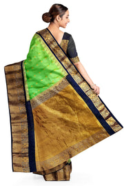 Gadwal pure silk saree in green with  peacock &  disc  motif in gold.