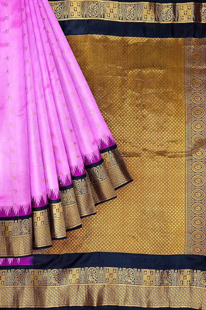 Gadwal pure silk saree in pink with  peacock &  disc  motif in gold.