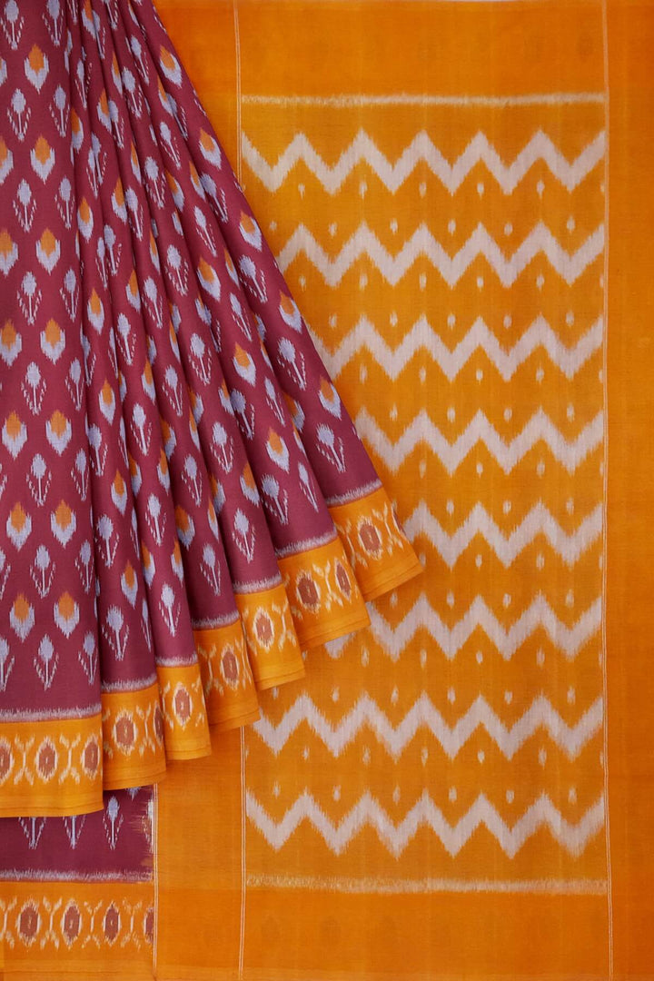 Handwoven ikat pure cotton saree in maroon with floral motifs