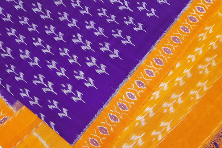 Handwoven ikat pure cotton saree in violet  with floral motifs .