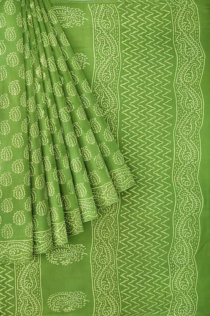 Jaipur mul cotton saree in green  with paisley motifs.