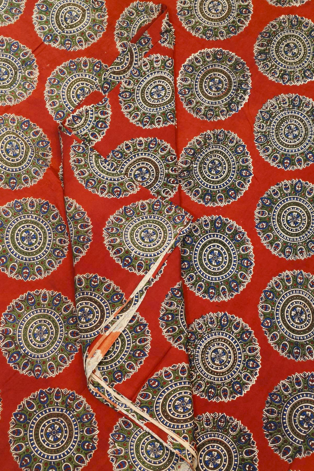 Kalamkari  silk cotton fabric in maroon with  disc motifs