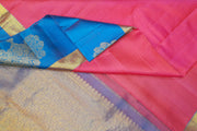 Kanchi silk brocade saree in pink with floral motifs in border and a rich pallu