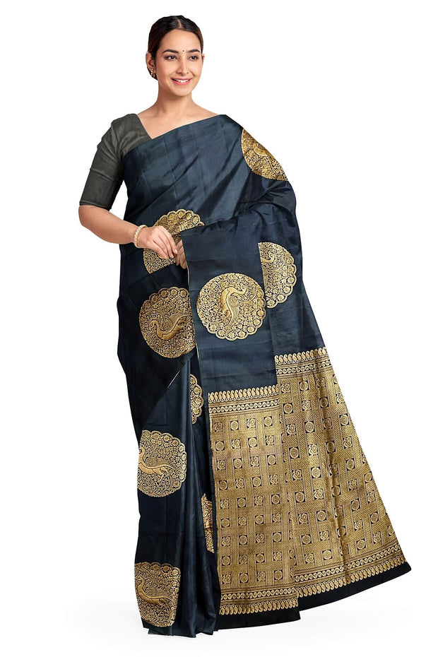 Kanchi soft silk saree in black with peacock motifs in gold