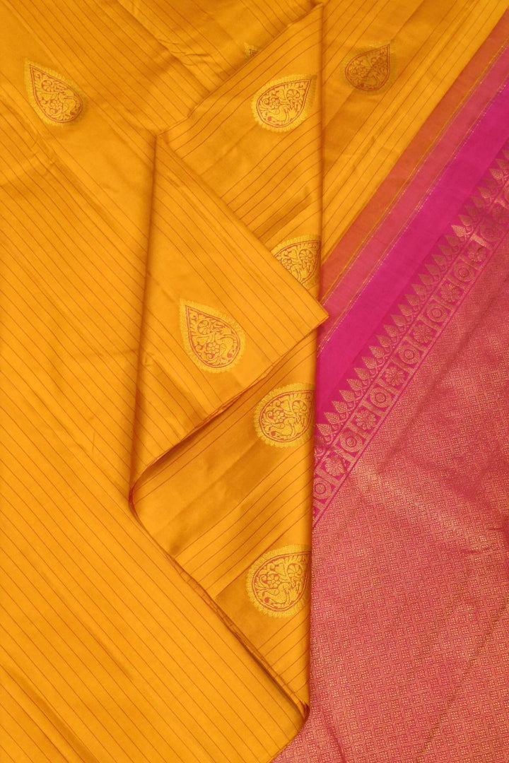 Kanchi borderless pure silk saree in mustard  with paisley motifs