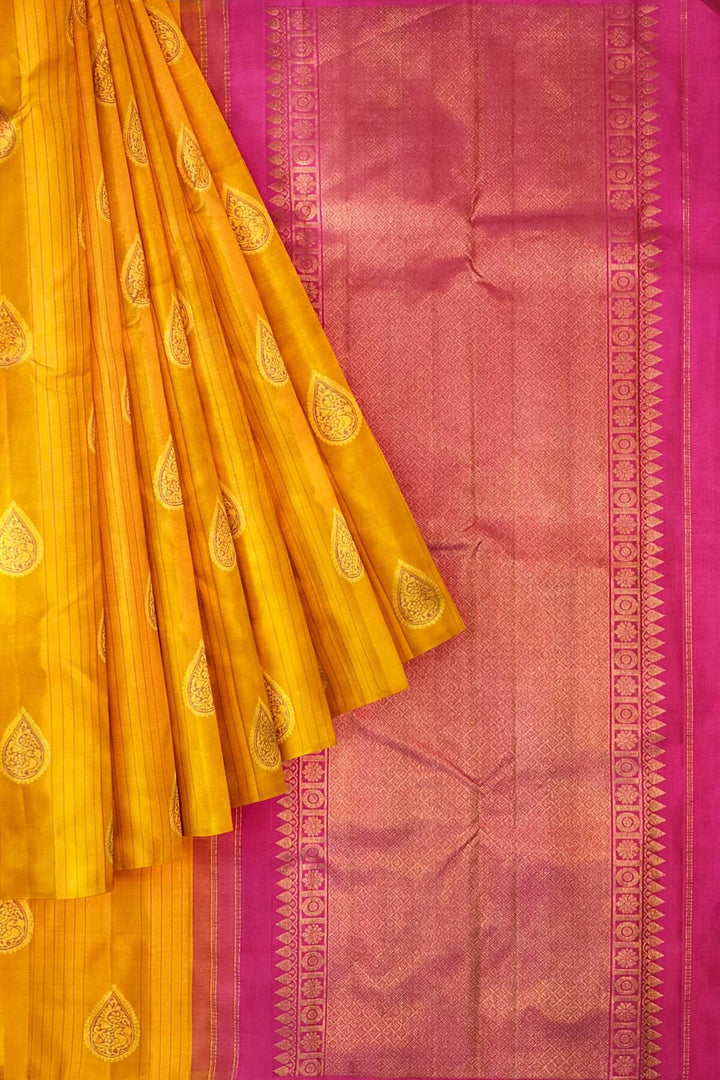 Kanchi borderless pure silk saree in mustard  with paisley motifs
