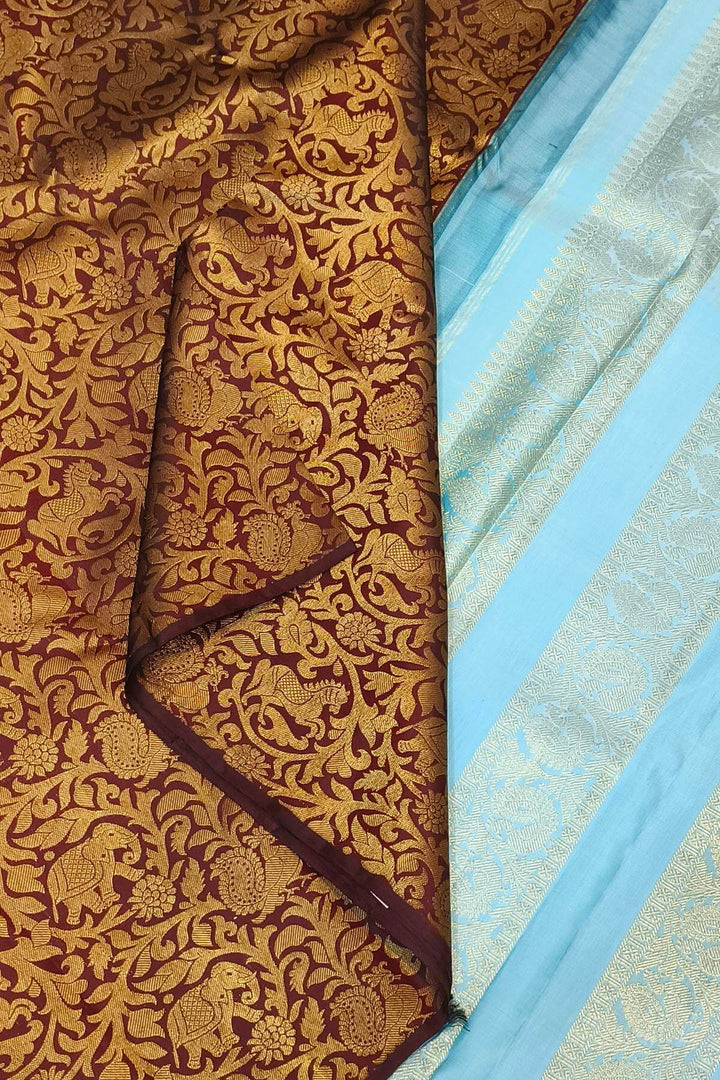 Kanchi  pure silk  brocade saree in brown with floral & animal motifs