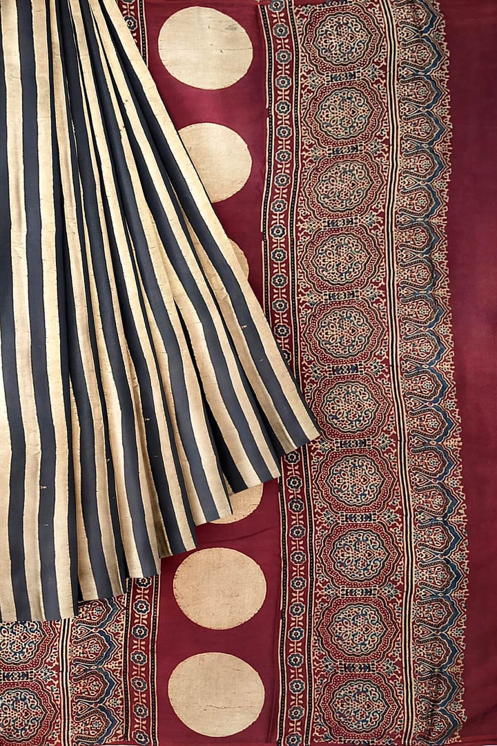 Modal silk saree in cream with stripes  and hand block print ajrakh pallu