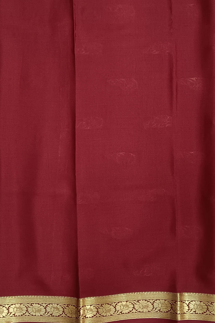 Mysore crepe pure silk saree in green with small motifs all over the body.