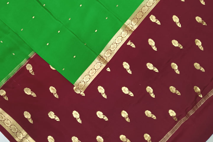 Mysore crepe pure silk saree in green with small motifs all over the body.