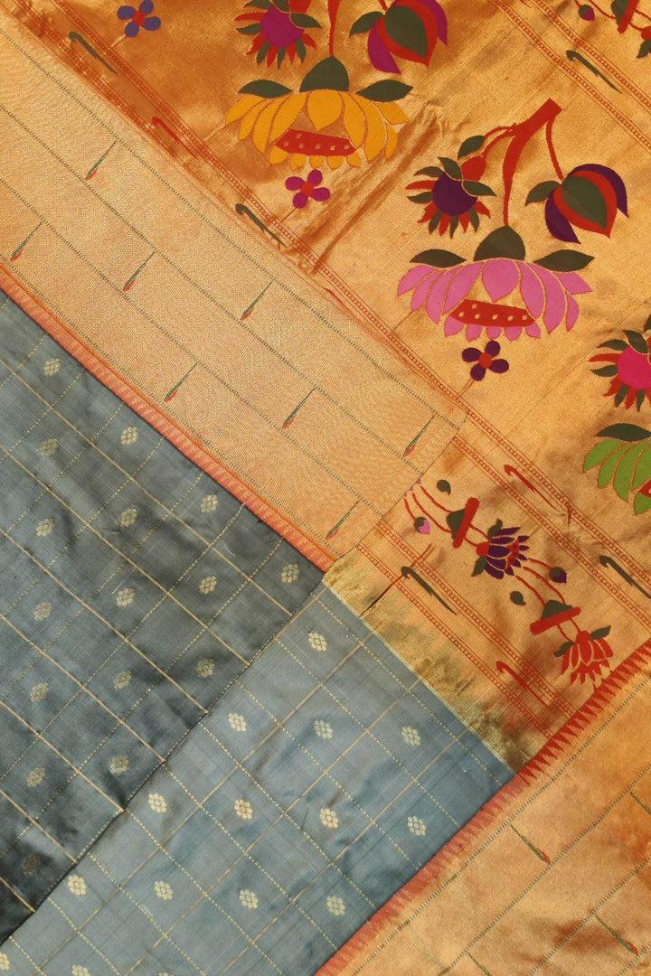 Paithani pure silk saree in grey with checks & buttis on the body .