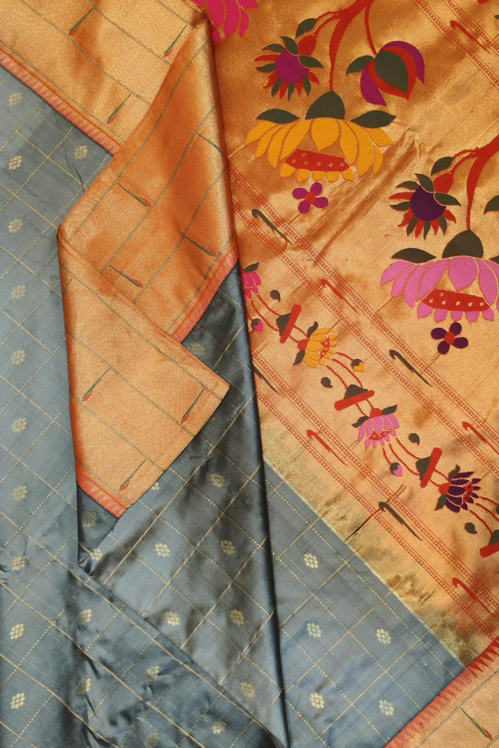 Paithani pure silk saree in grey with checks & buttis on the body .