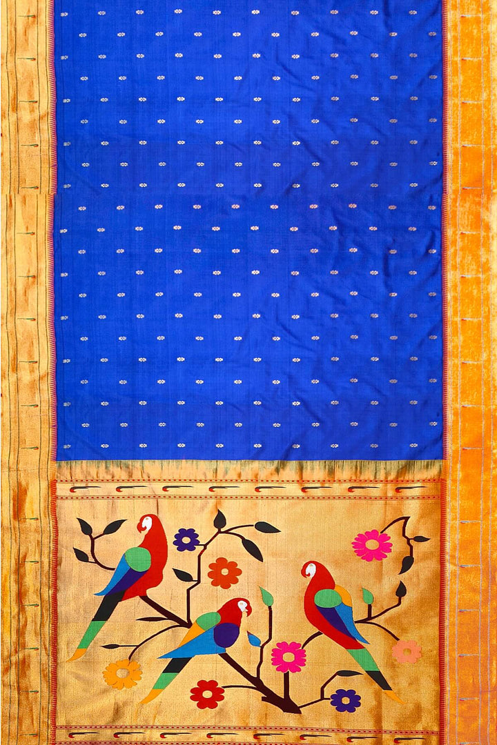 Paithani pure silk saree in royal blue with small floral motifs  on the body .