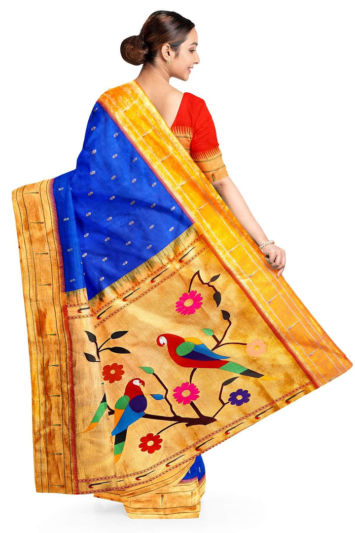 Paithani pure silk saree in royal blue with small floral motifs  on the body .