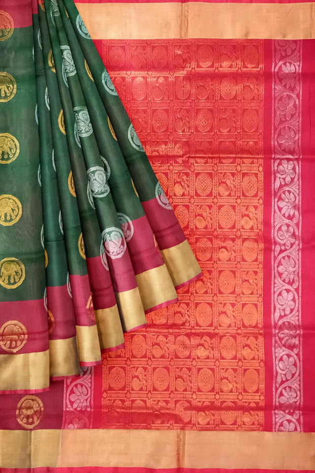 Handwoven Uppada pure silk saree in bottle green with gold & silver motifs .