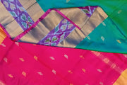 Handwoven Uppada pure silk saree in teal green with ikat border