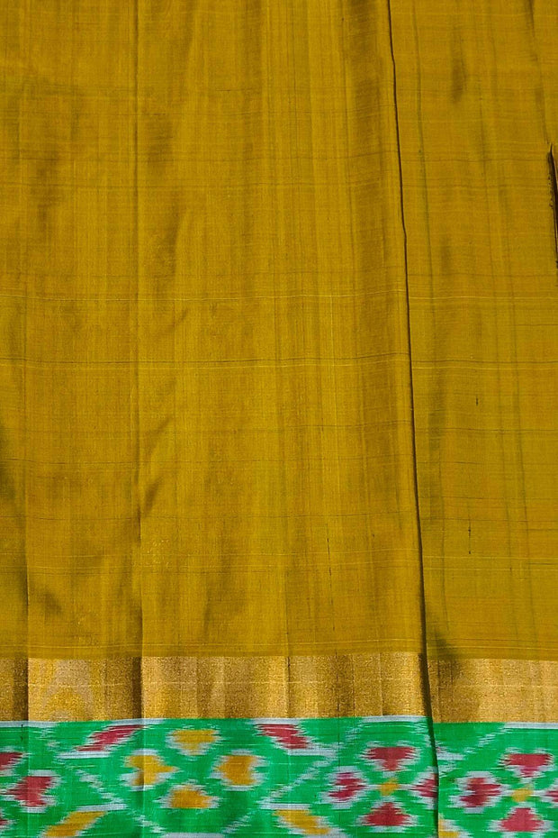 Handwoven Uppada pure silk saree in bottle green  with  ikat border