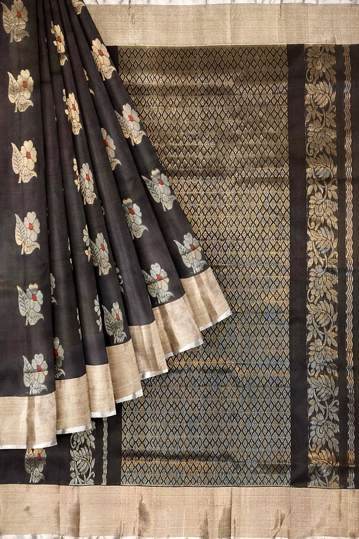 Handwoven Uppada pure silk saree in black with  floral motifs .