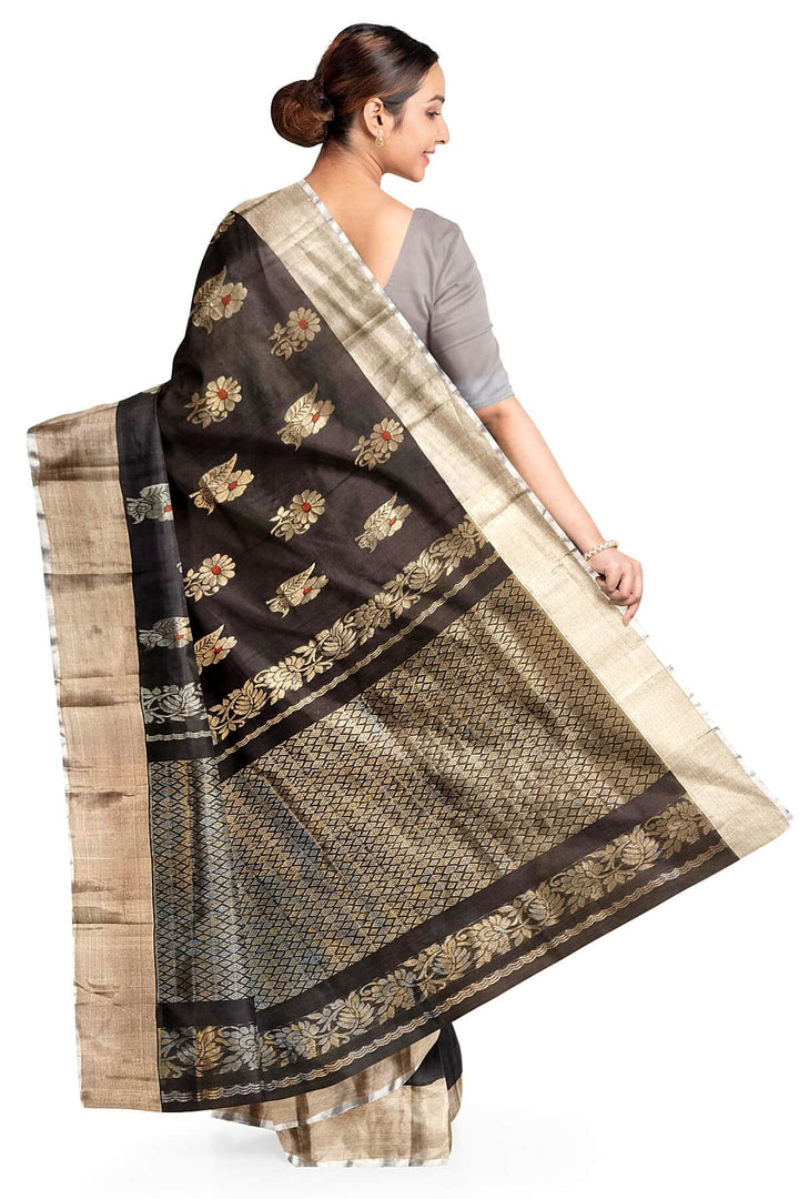 Handwoven Uppada pure silk saree in black with  floral motifs .