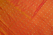 Pure silk fabric in double shaded honey colour with small motifs in gold