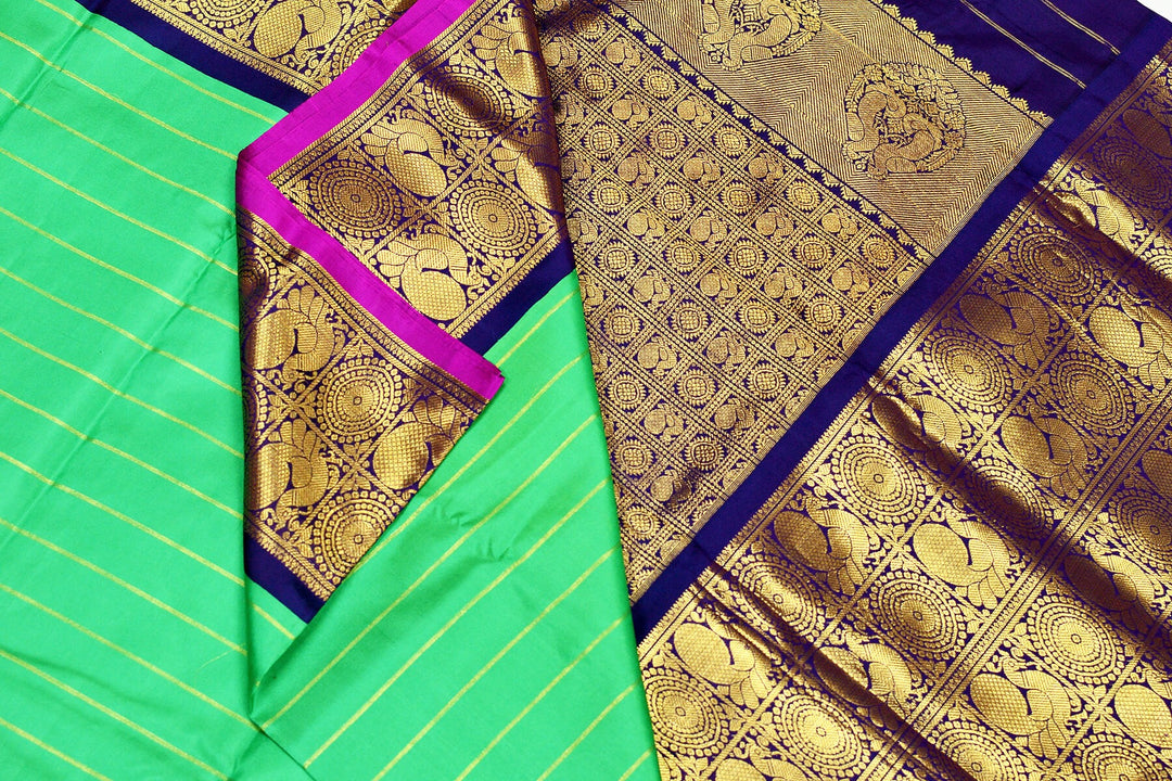 Kanchi pure silk pure zari saree in green with zari stripes