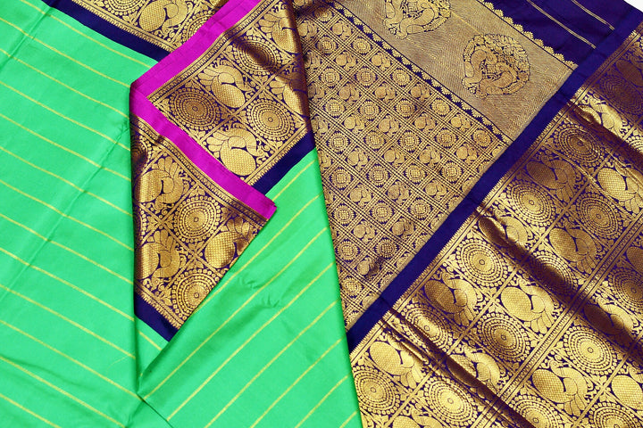 Kanchi pure silk pure zari saree in green with zari stripes