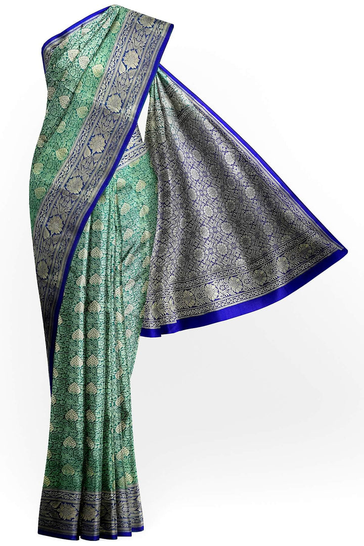 Handloom Banarasi silk saree in satin weave in red with floral motifs all over the body.