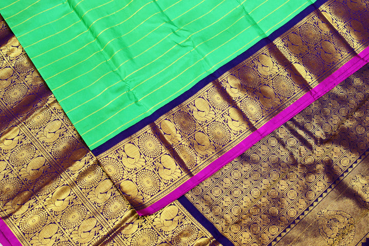Kanchi pure silk pure zari saree in green with zari stripes