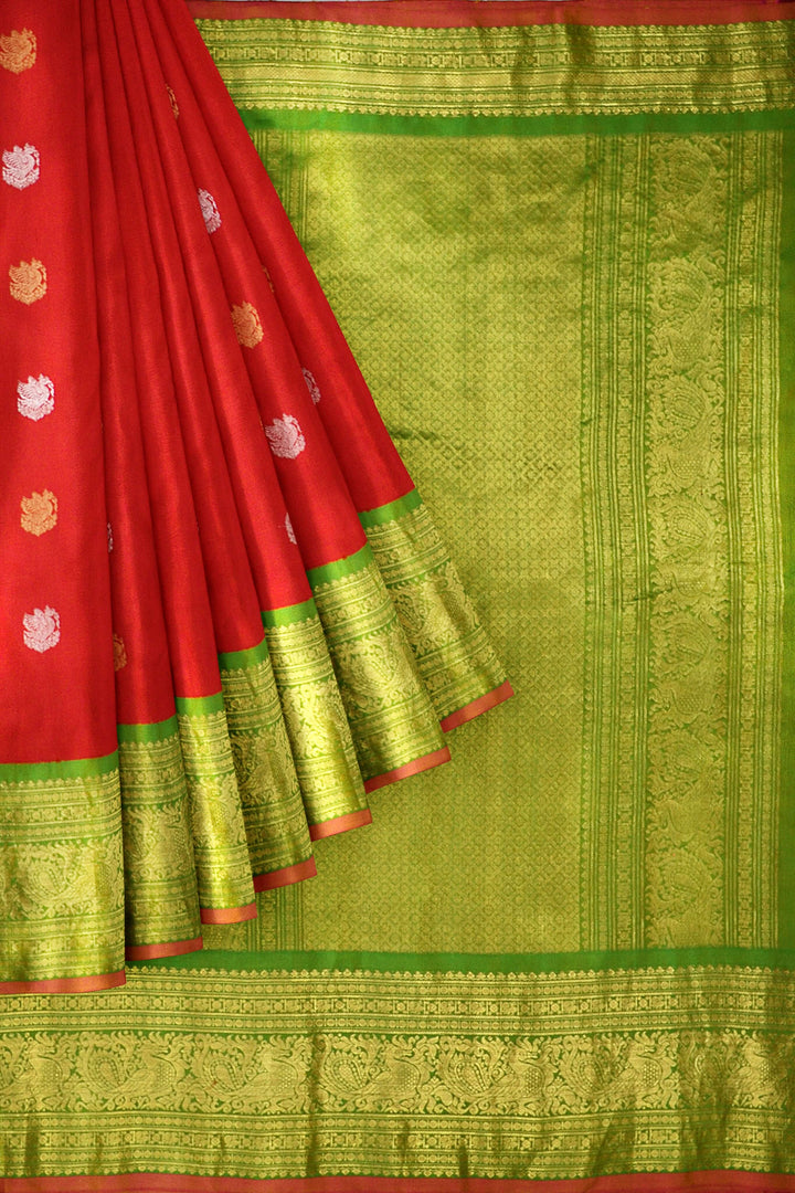 Handwoven Kanchi pure silk pure zari saree in red with peacock motifs in gold and silver