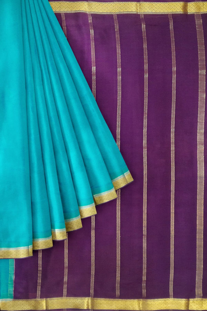 Mysore  crepe pure silk saree in  blue  with contrast pallu in purple