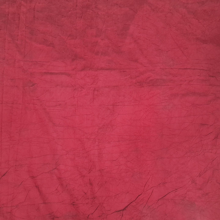 Crushed silk fabric in maroon