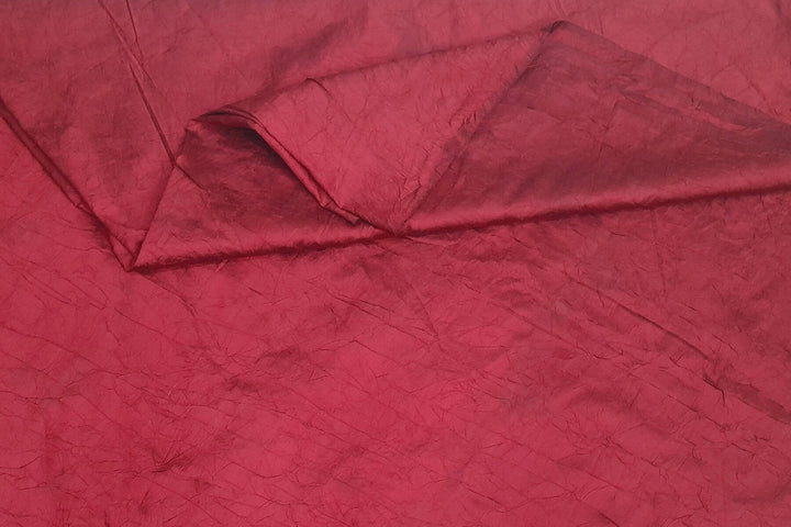 Crushed silk fabric in maroon