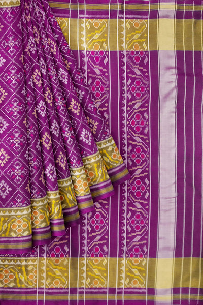 Handwoven Patola pure silk saree in purple  in choktha bhat ( diamond ) pattern