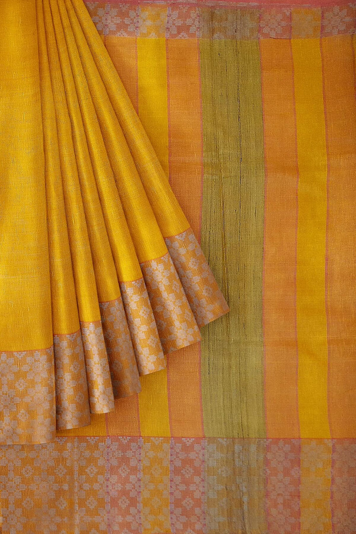 Handloom desi tussar pure silk saree in yellow with floral pattern in border