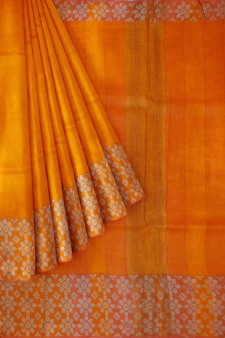 Handloom desi tussar pure silk saree in orange with floral pattern in border