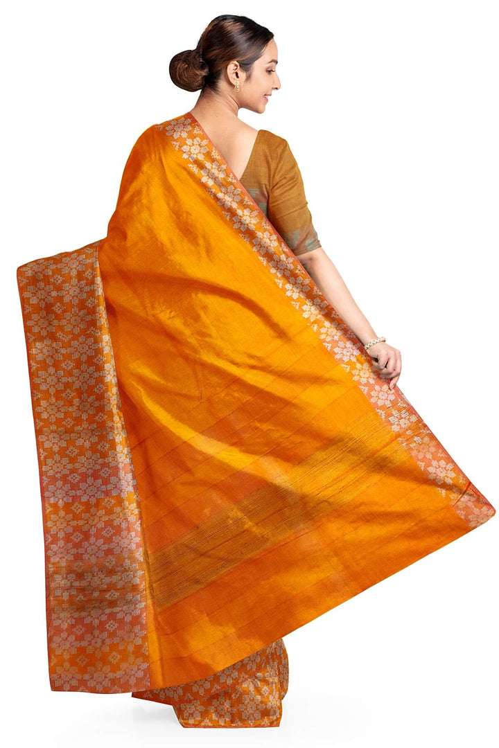 Handloom desi tussar pure silk saree in orange with floral pattern in border