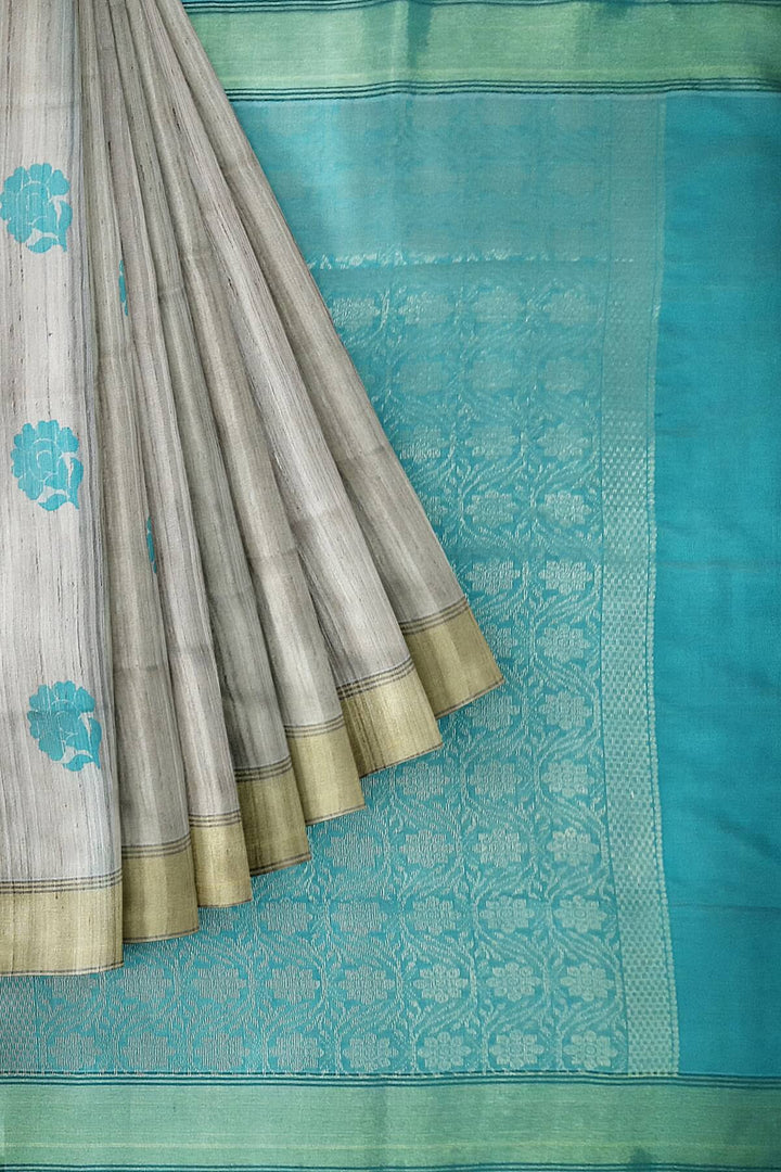 Desi tussar pure silk saree in teal blue  colour floral motifs on the body and a zari pallu in floral pattern