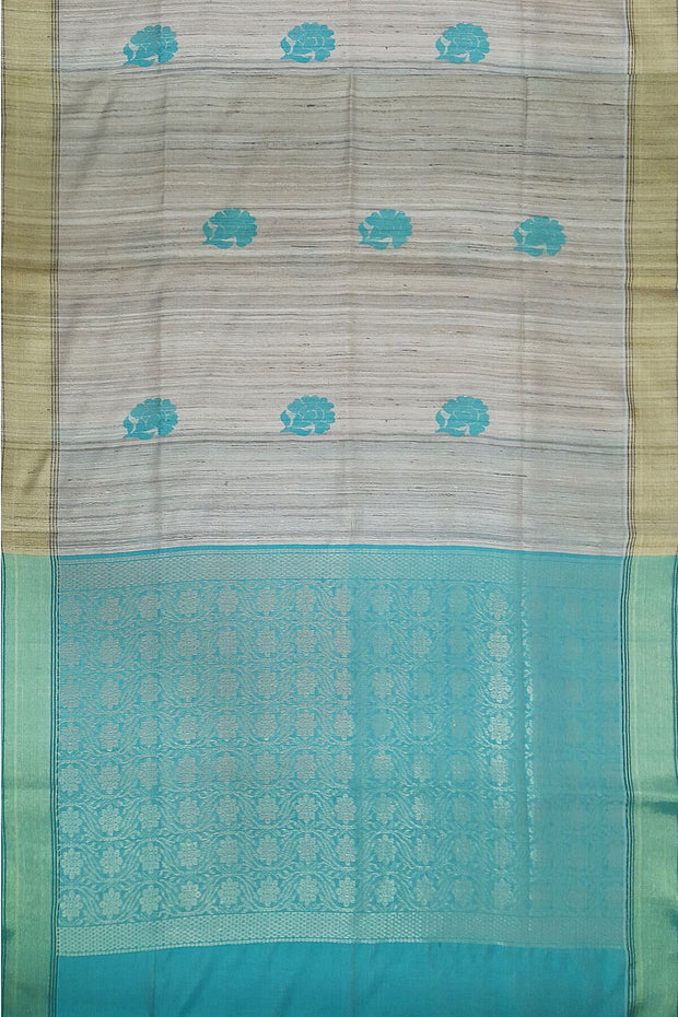 Desi tussar pure silk saree in teal blue  colour floral motifs on the body and a zari pallu in floral pattern