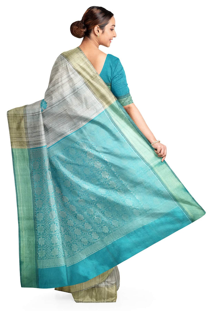 Desi tussar pure silk saree in teal blue  colour floral motifs on the body and a zari pallu in floral pattern