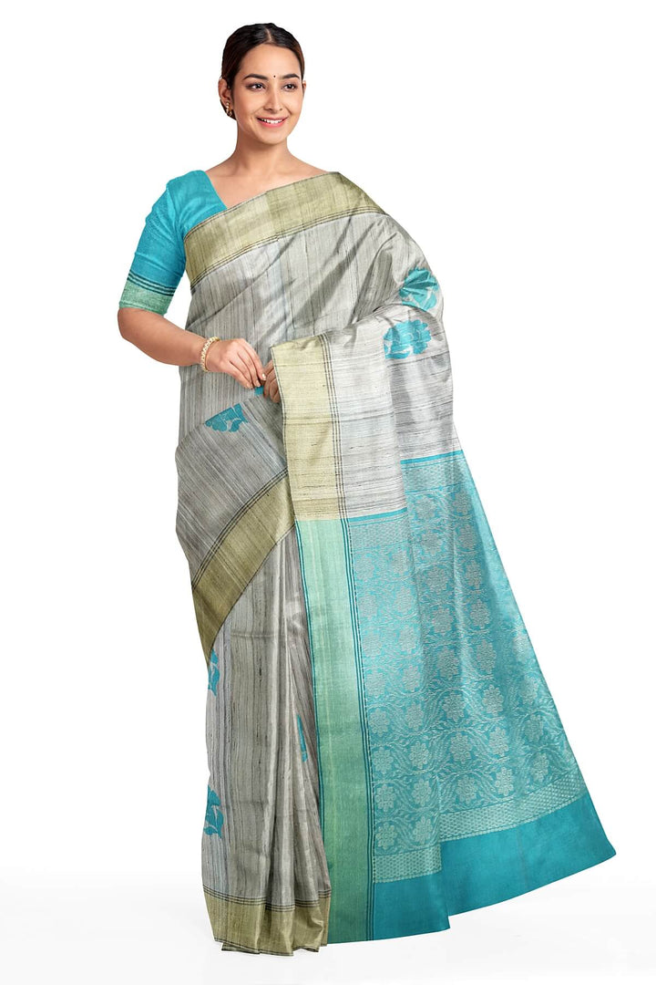 Desi tussar pure silk saree in teal blue  colour floral motifs on the body and a zari pallu in floral pattern