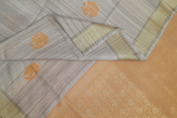 Desi tussar pure silk saree in orange  colour floral motifs on the body and a zari pallu in floral pattern