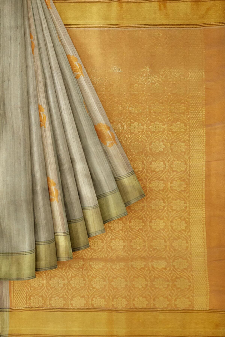 Desi tussar pure silk saree in orange  colour floral motifs on the body and a zari pallu in floral pattern